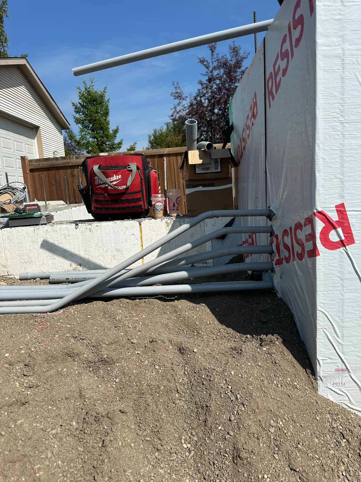 Bundle of conduit entering a new foundation